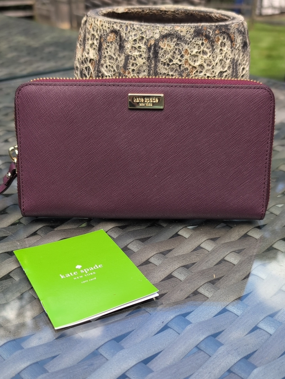 kate spade plum saffiano zip-around wallet with gold logo EUC